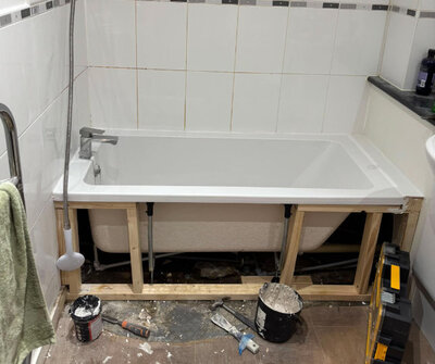 New bath set on a timber frame part-way through a bathroom installation