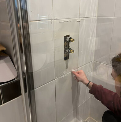 Protecting a shower mixer valve while working on tiled walls