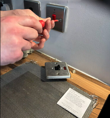 Replacing a switched fused spur faceplate during electrical repairs
